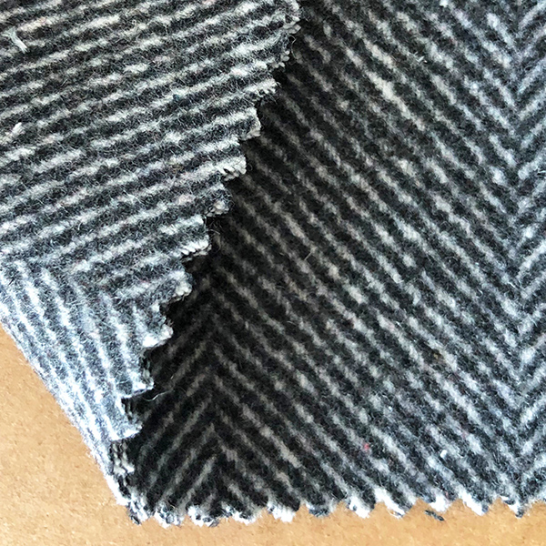 粗呢面料工廠供應(yīng)現(xiàn)貨女裝人字呢布料